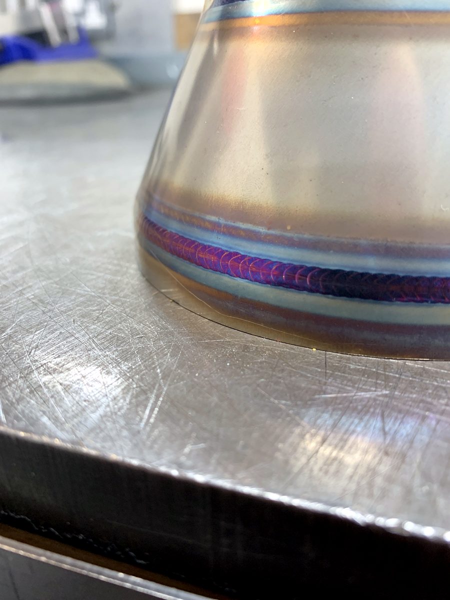Stainless steel cone section with a coloured TIG weld bead